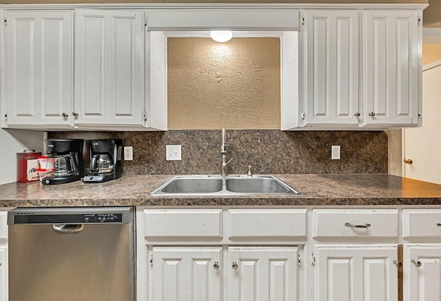 kitchen with white cabinets, stainless steel dishwasher, and sink