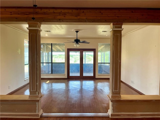 doorway with ceiling fan, wood-type flooring, french doors, and decorative columns