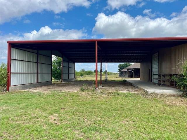 view of car parking featuring a lawn