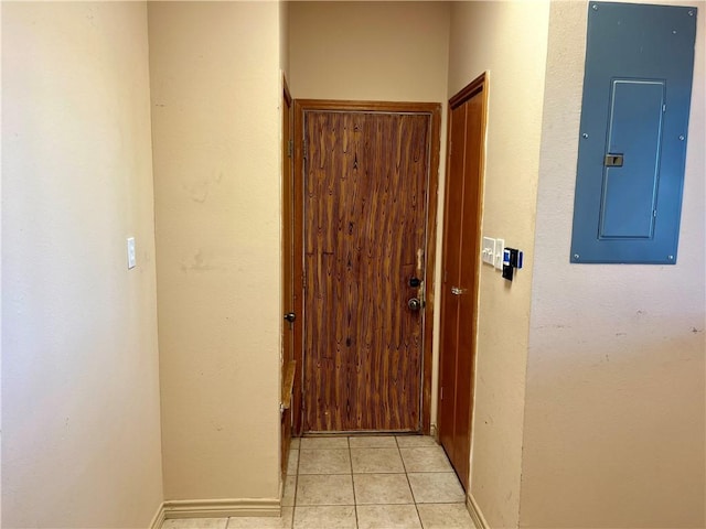 entryway with light tile patterned floors and electric panel