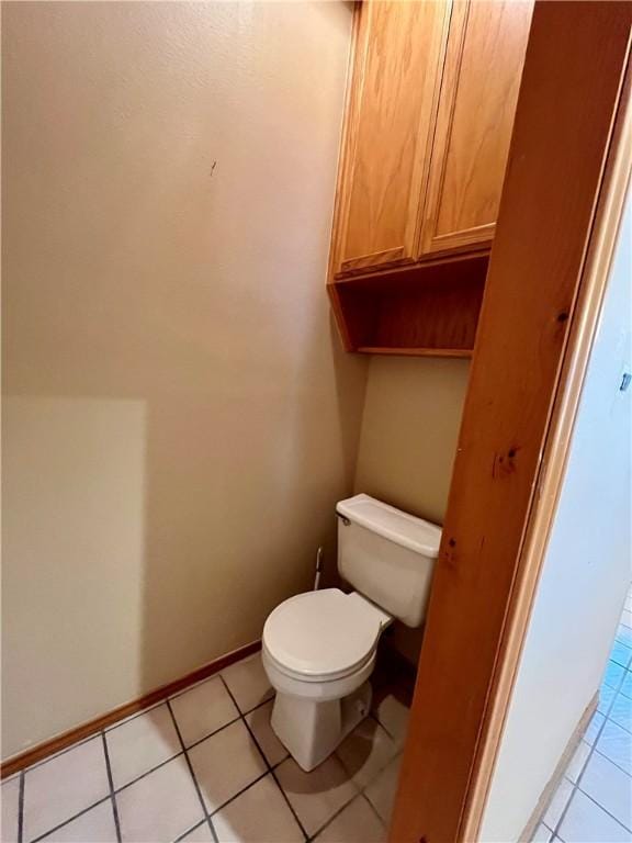 bathroom featuring tile patterned floors and toilet