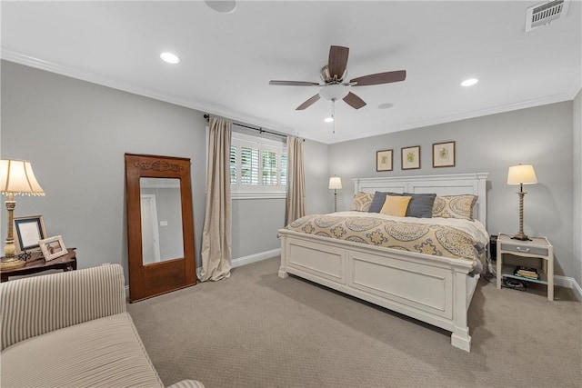 bedroom with recessed lighting, light colored carpet, visible vents, baseboards, and crown molding