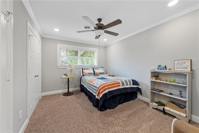 bedroom featuring carpet floors, crown molding, and baseboards