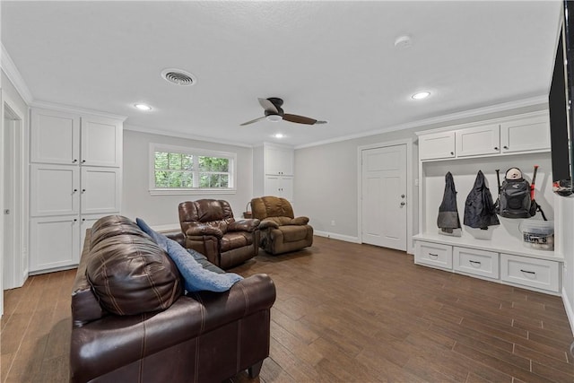 living room with baseboards, visible vents, wood finished floors, crown molding, and recessed lighting