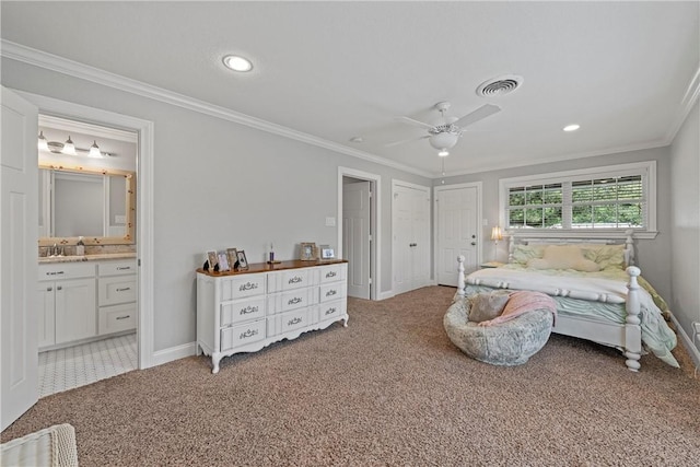 bedroom with connected bathroom, light colored carpet, crown molding, and baseboards