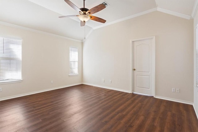 empty room featuring dark wood finished floors, lofted ceiling, visible vents, ornamental molding, and baseboards