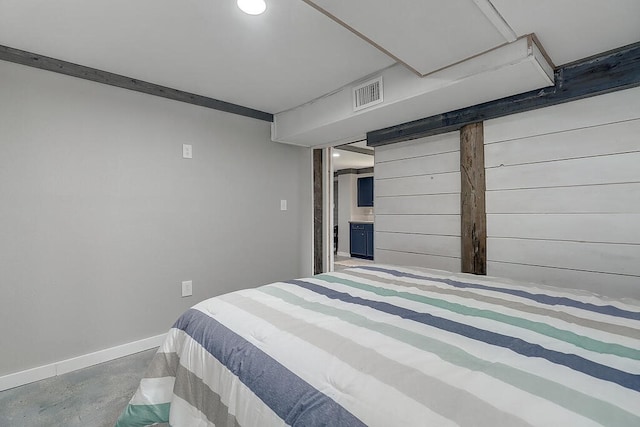 bedroom featuring concrete floors