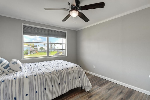 bedroom featuring ceiling fan, ornamental molding, and dark wood-type flooring