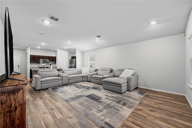 living room with dark wood-type flooring