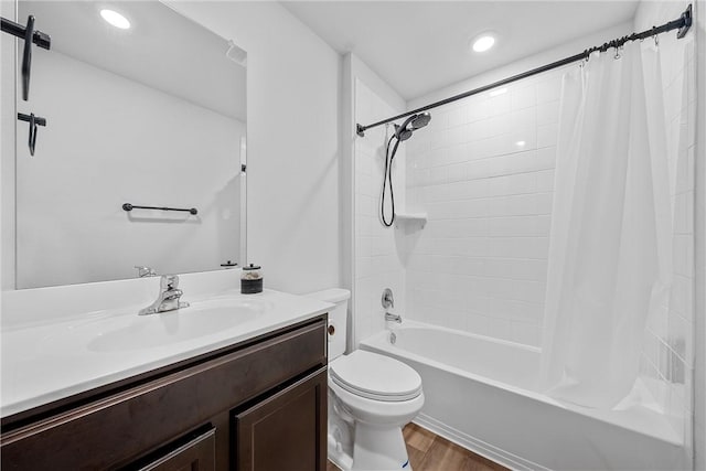 full bathroom featuring toilet, vanity, shower / bath combination with curtain, and hardwood / wood-style flooring