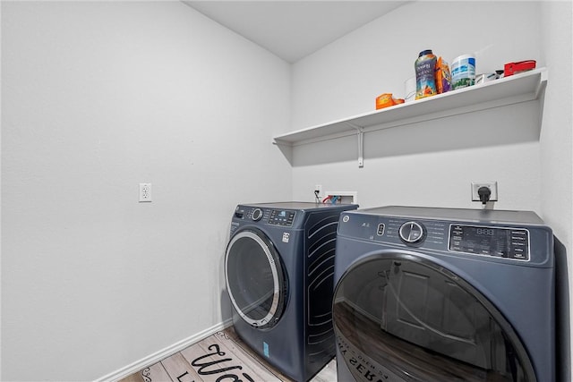 laundry area with washing machine and dryer