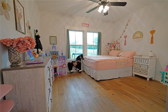 bedroom featuring light hardwood / wood-style floors and ceiling fan