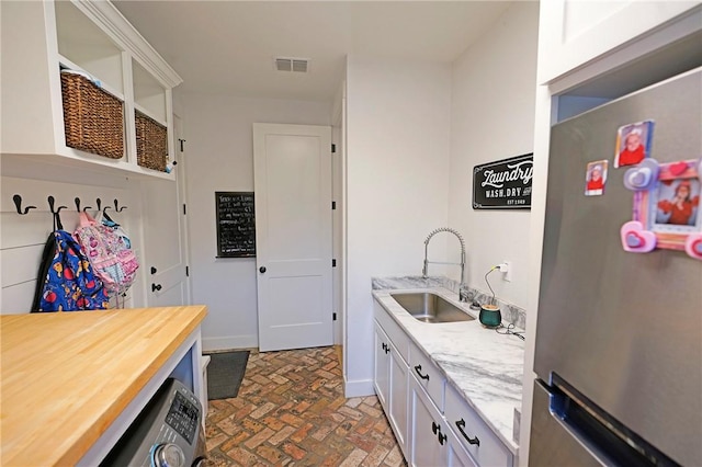 laundry room with sink