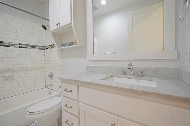 full bathroom with toilet, tiled shower / bath, and vanity