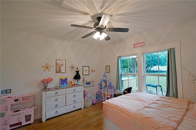 bedroom featuring ceiling fan and light hardwood / wood-style floors