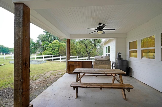 view of patio / terrace featuring ceiling fan and grilling area