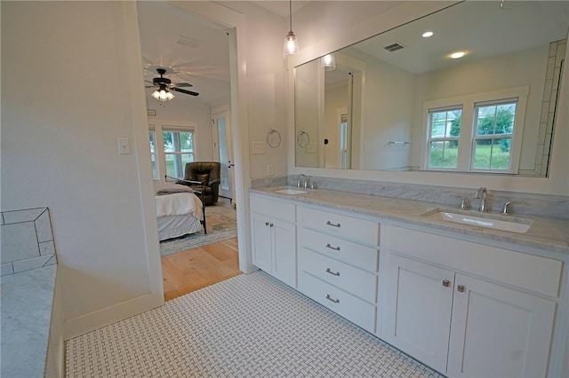 bathroom with vanity, ceiling fan, and tile patterned flooring