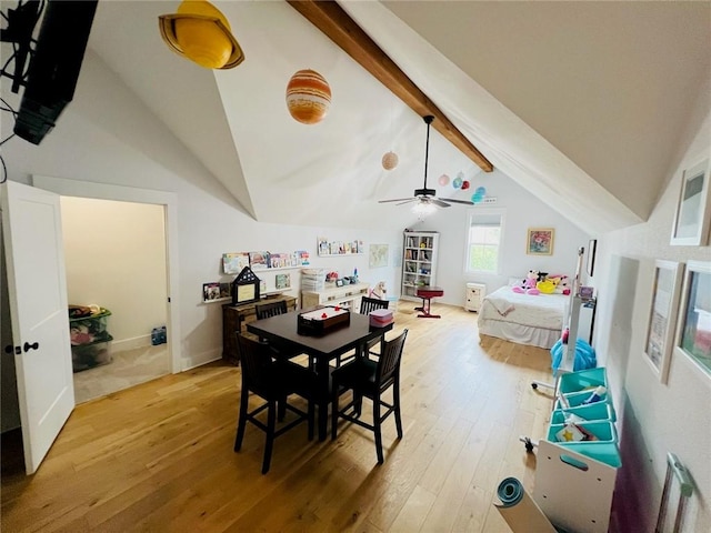 dining room featuring hardwood / wood-style flooring and lofted ceiling with beams