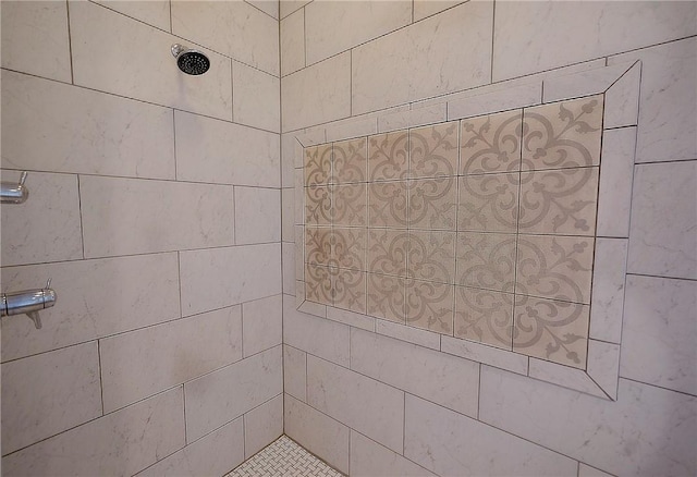 bathroom with a tile shower