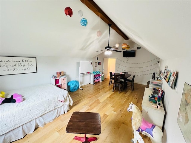 bedroom with hardwood / wood-style flooring, ceiling fan, and lofted ceiling with beams