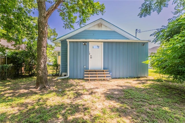 view of outbuilding with a yard