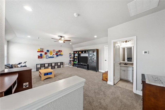 living room featuring a ceiling fan, baseboards, visible vents, recessed lighting, and light carpet