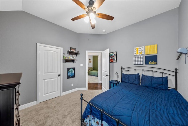 bedroom with baseboards, lofted ceiling, ceiling fan, and carpet flooring