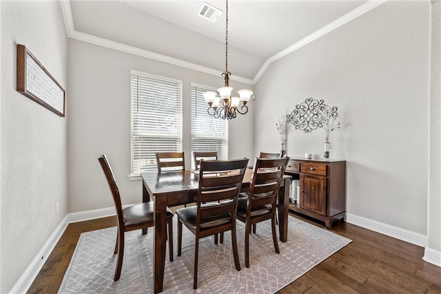 dining room with a notable chandelier, visible vents, dark wood-type flooring, and baseboards