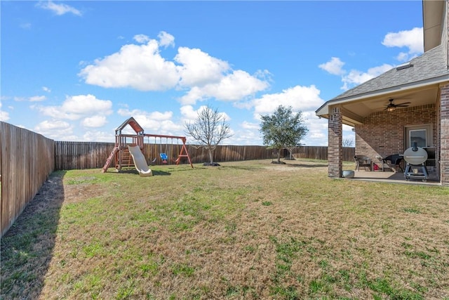 view of yard with a fenced backyard, a playground, ceiling fan, and a patio area