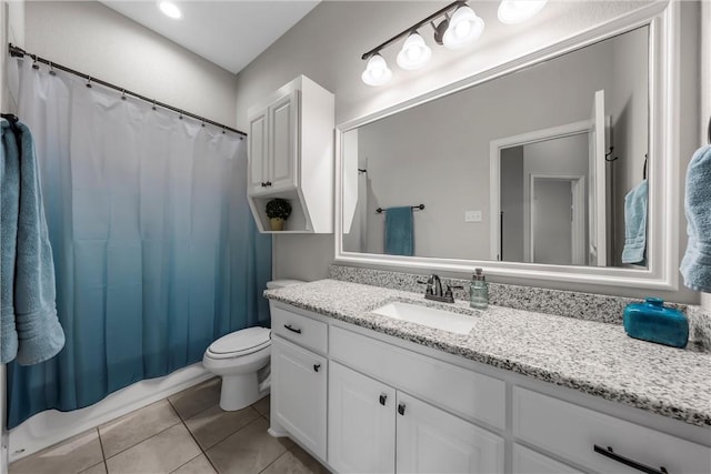 bathroom with tile patterned flooring, a shower with shower curtain, toilet, and vanity