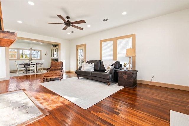 living room with ceiling fan and wood-type flooring