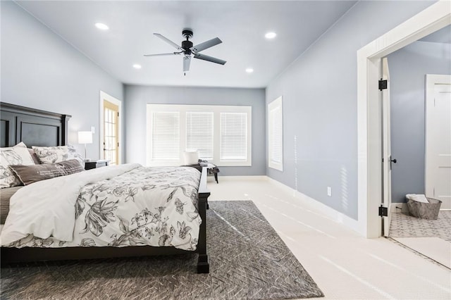 bedroom with ceiling fan and carpet flooring