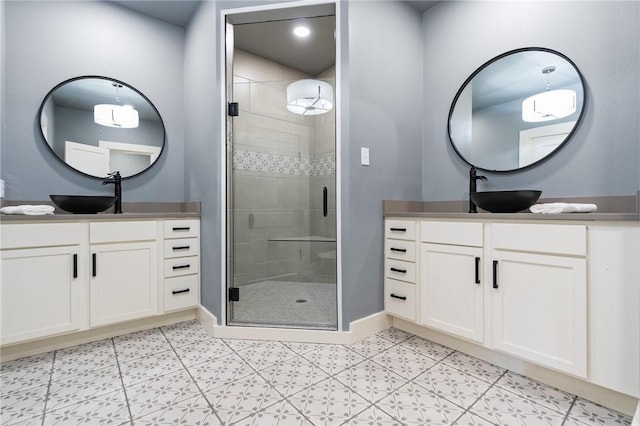 bathroom with an enclosed shower and vanity