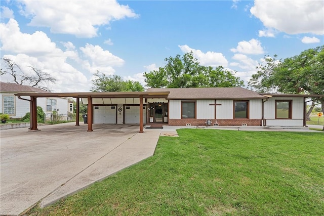 ranch-style home featuring a carport, a garage, and a front lawn