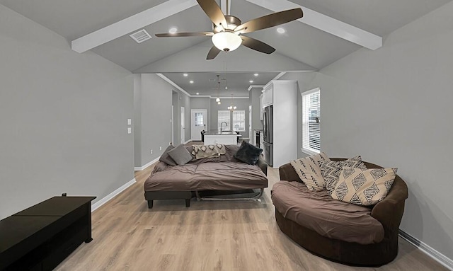 living area with lofted ceiling with beams, light wood-style flooring, and baseboards