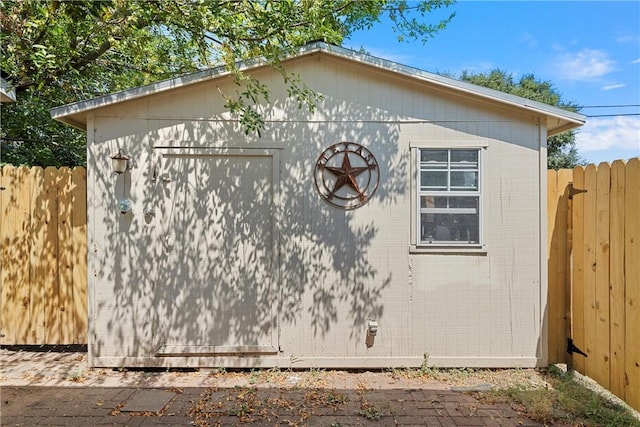 view of side of property with a shed