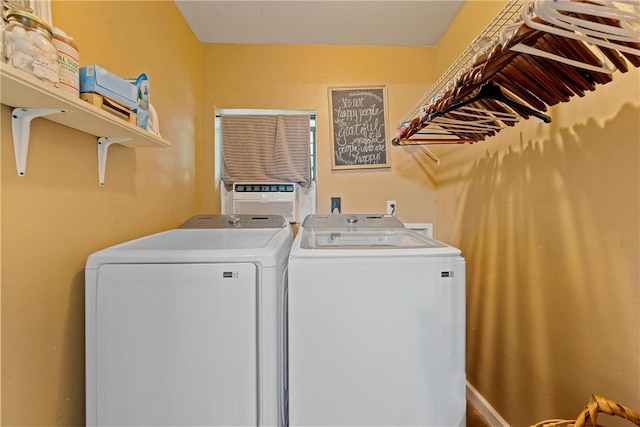 laundry area featuring washing machine and clothes dryer