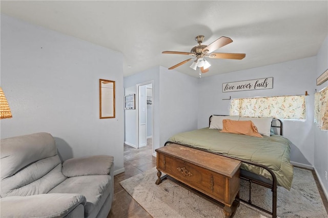 tiled bedroom with ceiling fan