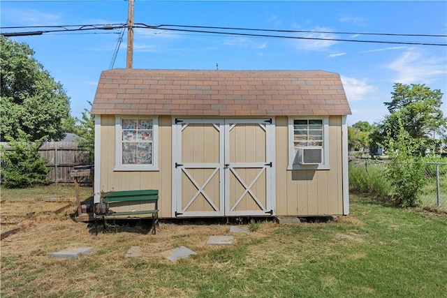 view of outbuilding with a yard and cooling unit