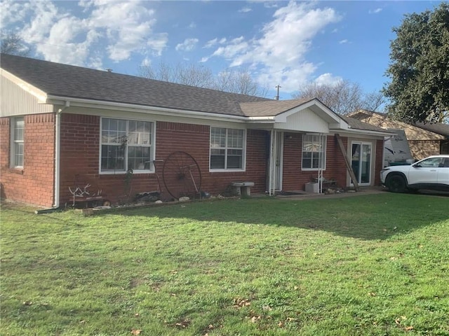 ranch-style home with a front lawn