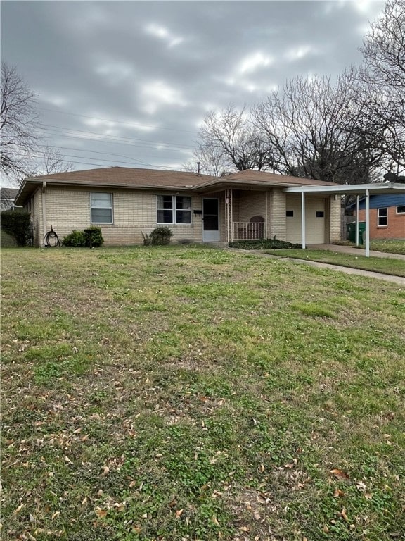 ranch-style house with a carport and a front yard