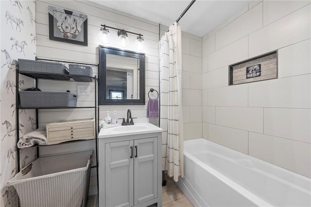 bathroom with vanity, tile patterned floors, and shower / bath combo with shower curtain