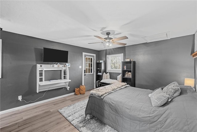 bedroom featuring hardwood / wood-style flooring and ceiling fan