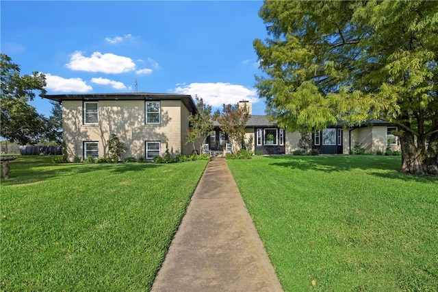 view of front of house with a front lawn