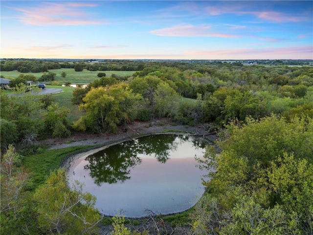 aerial view at dusk with a water view