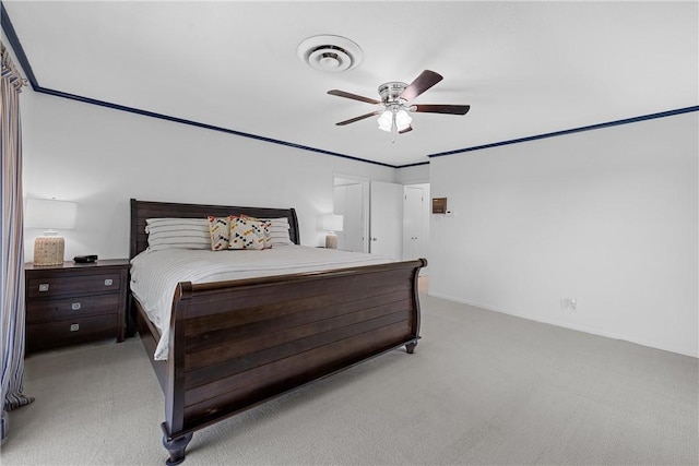 bedroom featuring light colored carpet and ceiling fan