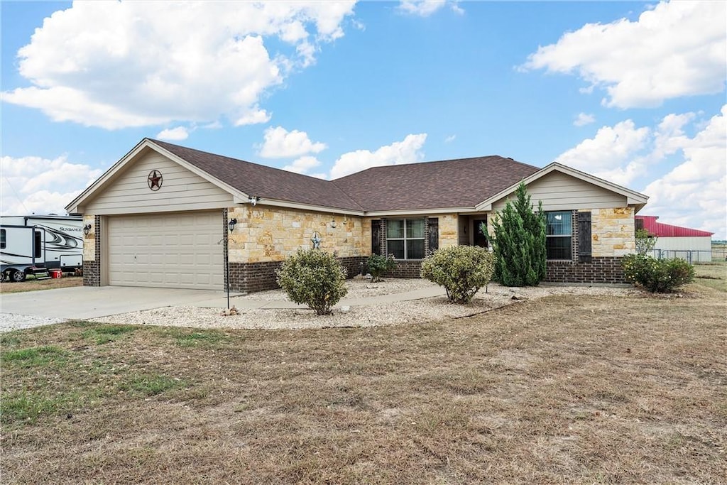 ranch-style home featuring a garage