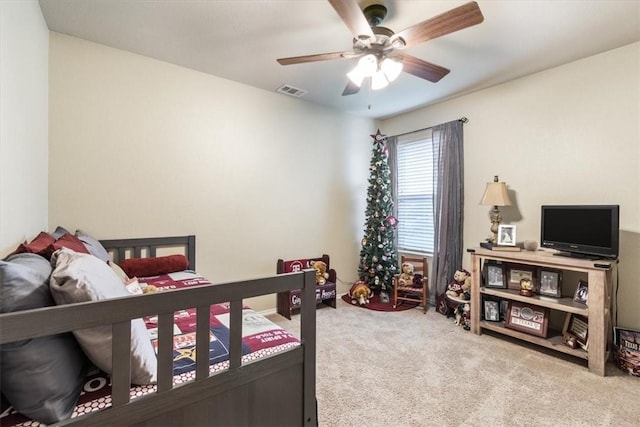 bedroom featuring ceiling fan and light colored carpet