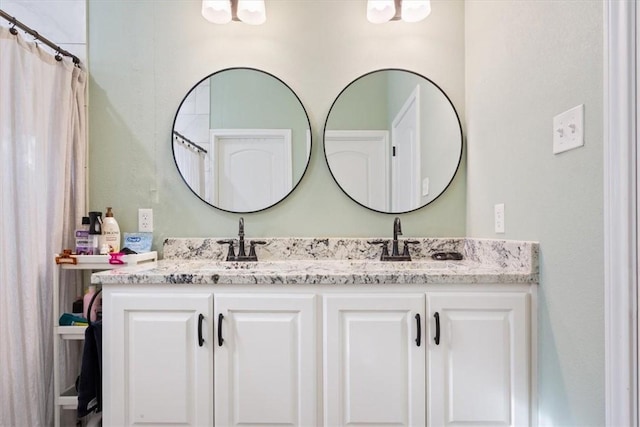 bathroom with a shower with curtain and vanity