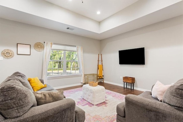 living room featuring dark wood-type flooring